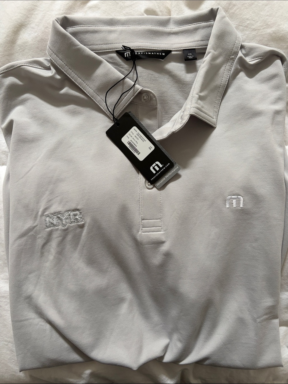 Travis Mathew Light Gray Polo with Subtle Embroidered Logos